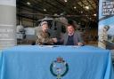 Lt Col Alice Archer and Pat Carter sign the Armed Forces Covenant