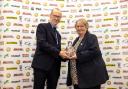 Salisbury FC club director Hilary Bilimore accepting the club's award from the FSA’s Nick Duckett