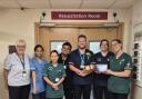 Braemar Lodge Home Manager Jackie Cash, far left, at Salisbury Hospital’s accident and emergency department handing out treats from residents and colleagues at the Colten Care home.