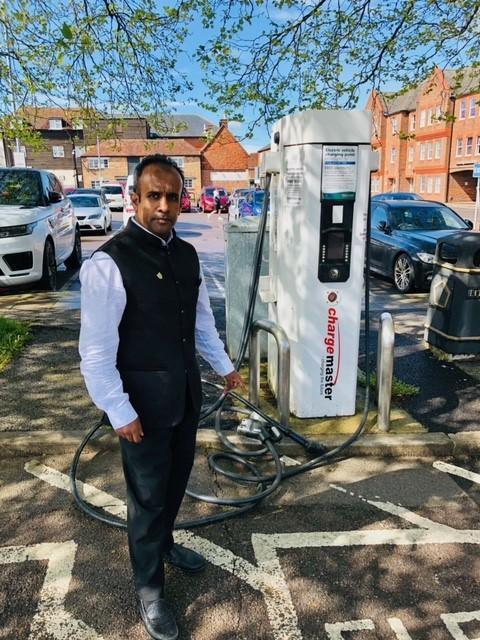 Salisbury Journal: Cllr Atiqul Hoque by the charging point on Brown Street