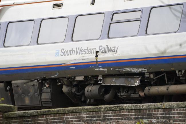A South Western Railway train carriage being lifted from the crash scene on Friday. Picture: Press Association.