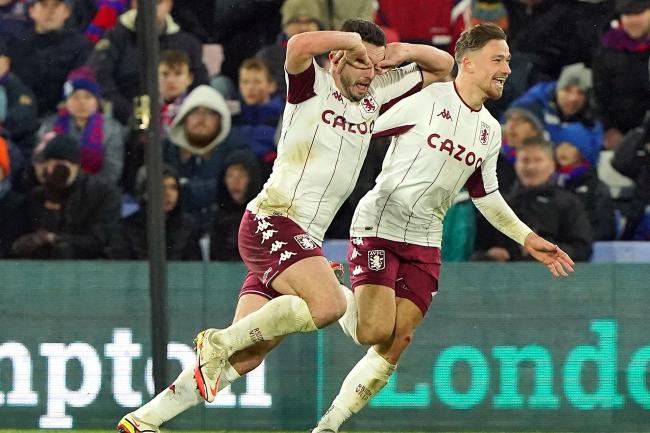 Aston Villa’s John McGinn (left) celebrates scoring at Crystal Palace