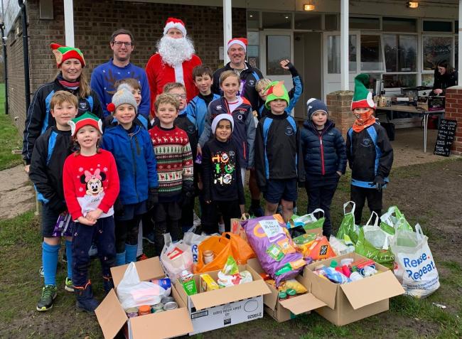 Fordingbridge Rugby Club members with donations for Ringwood Foodbank