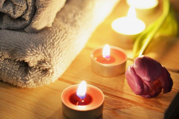 Salisbury Journal: A pile of towels, candles and a tulip. Credit: Canva