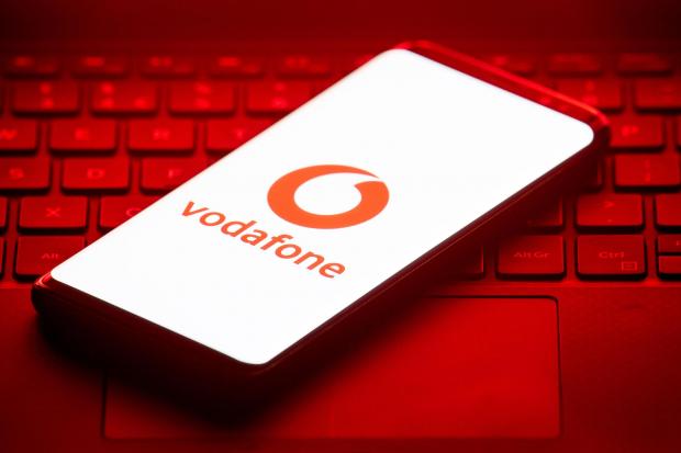 Salisbury Journal: Vodafone logo on a phone placed on a keyboard. Credit: PA