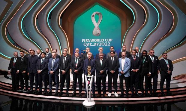Salisbury Journal: Managers, including England manager Gareth Southgate (back row third left), on stage during the FIFA World Cup Qatar 2022 Draw. Picture: PA