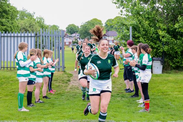 The team running onto the pitch with the guard of honour from Salisbury RFC's Girls section (Picture: Spencer Mulholland)