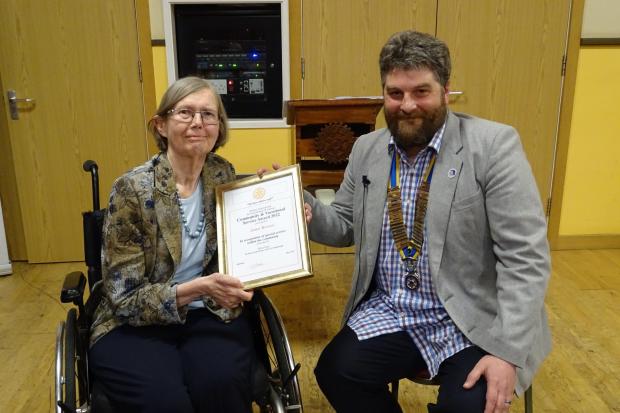 Janet Brown being presented with the Citizen of the Year award by the president of the Rotary Club of Fordingbridge, Will Peak