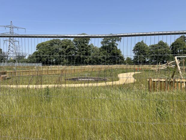Salisbury Journal: Metal fencing borders the unfinished playpark