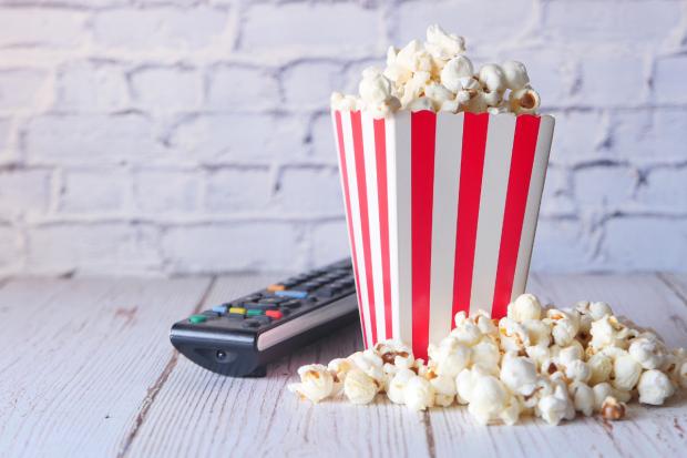 Salisbury Journal: A box of popcorn and a TV remote (Canva)