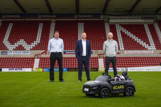 Swindon Town FC CEO Rob Angus, V Cars Regional Drive Director Jack Price and Danny Lee Head of Commercial at Swindon Town FC.