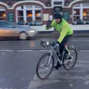 Tom Daley cycling in Fordingbridge. Still from a video by The Gourmet Grocer in High Street
