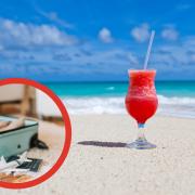Cocktail on a beach and inset, half-packed suitcase