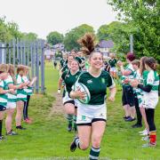 The team running onto the pitch with the guard of honour from Salisbury RFC's Girls section (Picture: Spencer Mulholland)