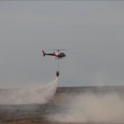 Helicopter deployed to tackle the Salisbury Plain wildfire. Credit: MOD 2022