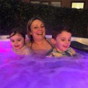 Kimberley Barber in the hot with her two children
