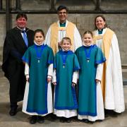 In front from left to right, the new girl choristers Alice Griffin, Matilda Macmillan and Phoebe Geary with, from left to right in back, Salisbury Cathedral School headmaster Clive Marriott, Dean of Salisbury Rev. Nick Papadopulos, and Canon Anna Macham.