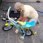 COGS member working on a bike during a bike service event.