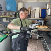 Ciprian Alupoaie cooking inside Selfie Pizza.