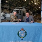 Lt Col Alice Archer and Pat Carter sign the Armed Forces Covenant