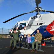 Children from Aerheart Class posing with Squadron Leaders Garry McKary and Liam Glasby
