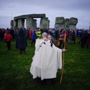 People take part in the winter solstice celebrations during sunrise at the Stonehenge