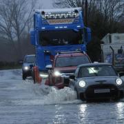 Some residents are attempting to drive through the floods.