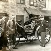 Phil Matthews (left) with his friend John Quinton and the restored coach.