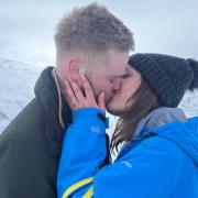 Injured man proposes to childhood sweetheart on top of mountain