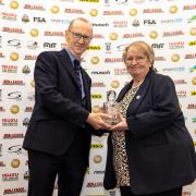 Salisbury FC club director Hilary Bilimore accepting the club's award from the FSA’s Nick Duckett