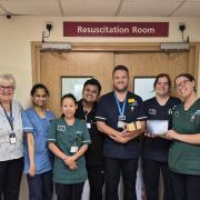 Braemar Lodge Home Manager Jackie Cash, far left, at Salisbury Hospital’s accident and emergency department handing out treats from residents and colleagues at the Colten Care home.