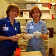 Student nurse Lizzie Smith (right), supervised by Heidi Lewis, senior sister on Laverstock Ward, part of the regional plastic surgery unit at Salisbury District Hospital. DA9905