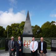 Paul Bedford, of Persimmon, Tidworth mayor Mark Connolly, Daryl Stevenson, the chairman of the Tidworth War Memorial Committee, and Allan Thomson, of Aspire Defence, with the war memorial. Picture by Katy Griffin