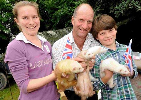 Lucinda, David and Henry Warne with their ferrets at Shrewton's celebrations. DC1646P3