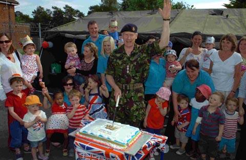 Garrison commander Paddy Tabor cuts the cake at the Haig Day Nursery jubilee party in Bulford. DC1610P6