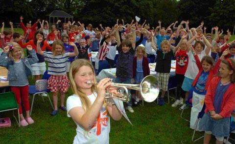 Emma May Farmer plays the national anthem at Whiteparish All Saints Primary School's celebrations. DC1627P2