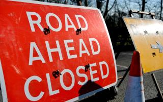 Road still closed after milk lorry crash