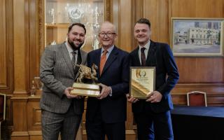 General manager Emil Szoma (left) accepted the Griffin Trophy from Fuller's chairman Michael Turner (centre) with David Nicoll, deputy manager (right).
