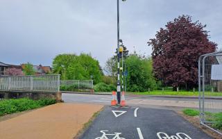 A new cycle path directs cyclists into the path of a Zebra crossing pole.