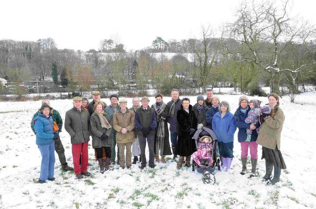 Objectors gather in front of the hill on which Arqiva wants to build its 82ft mast