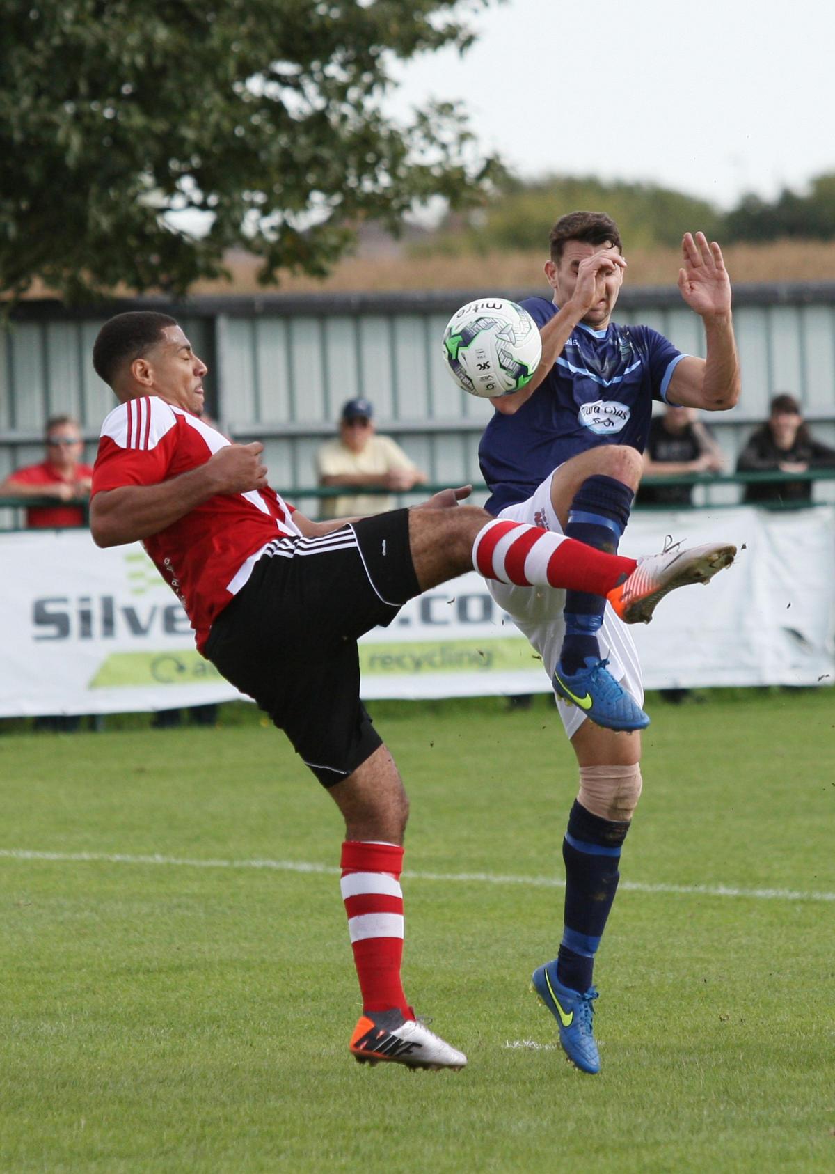 Kane O'Keefe challenges for the ball at Sholing